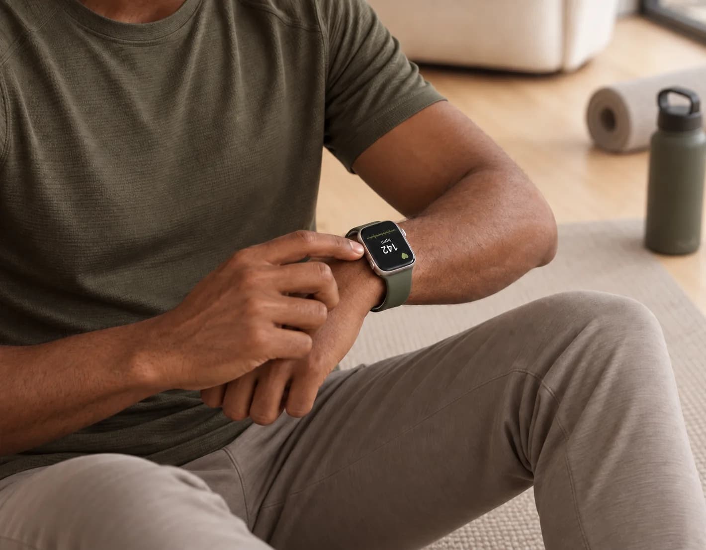 A man checking his heart rate on a smartwatch after a workout