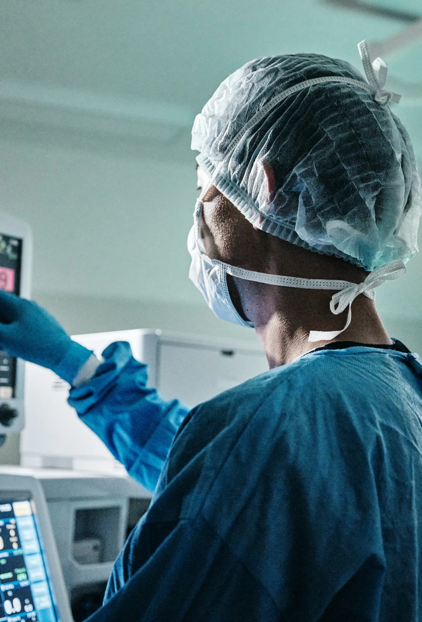 A surgeon checking a monitor